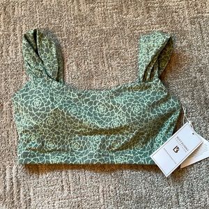 Brand new with tags. never worn. Green print BuffBunny sports bra